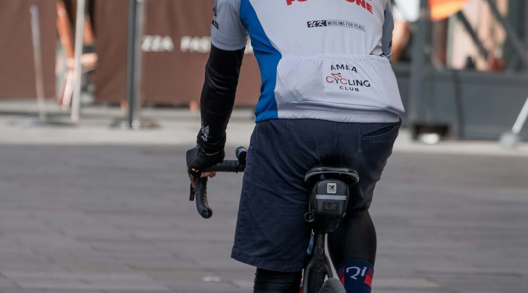 cyclist holding energy gel wrapper jersey pocket