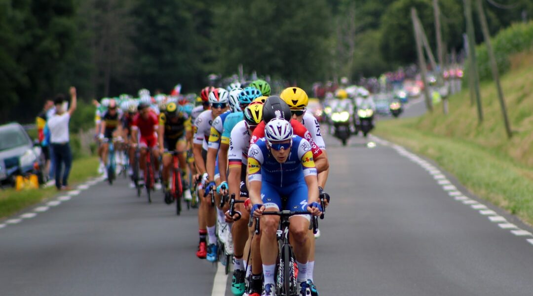 group of cyclists marching on highway