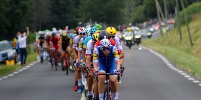 group of cyclists marching on highway